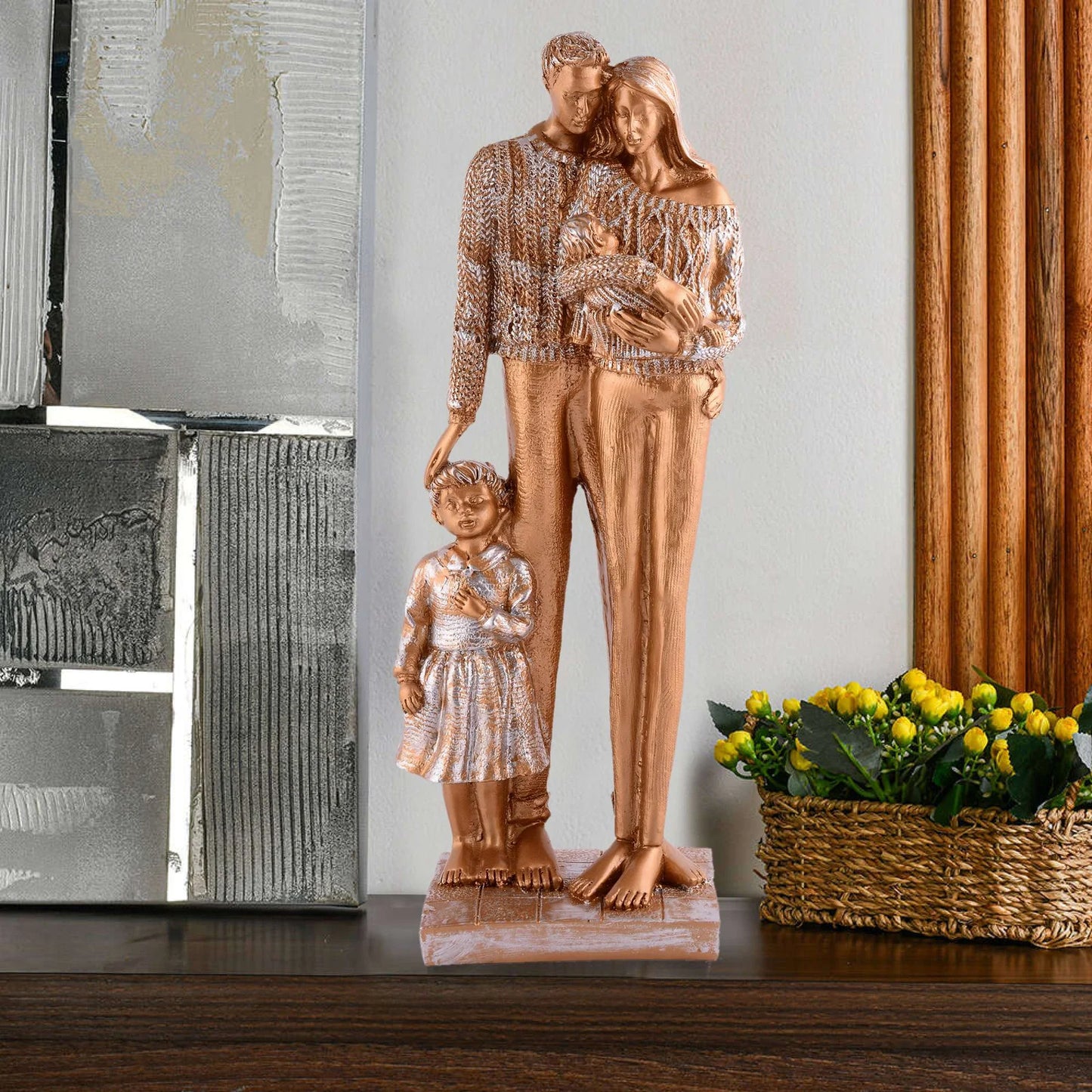Gold statue of a family on a dark marble surface with a cityscape in the background Bronze Family Love Sculpture