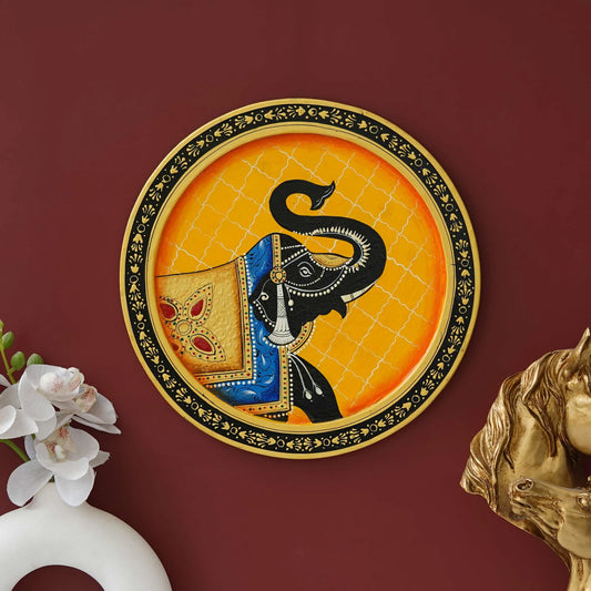 Unique Pichwai elephant wall art on a round plate, vibrant colors for home decor.