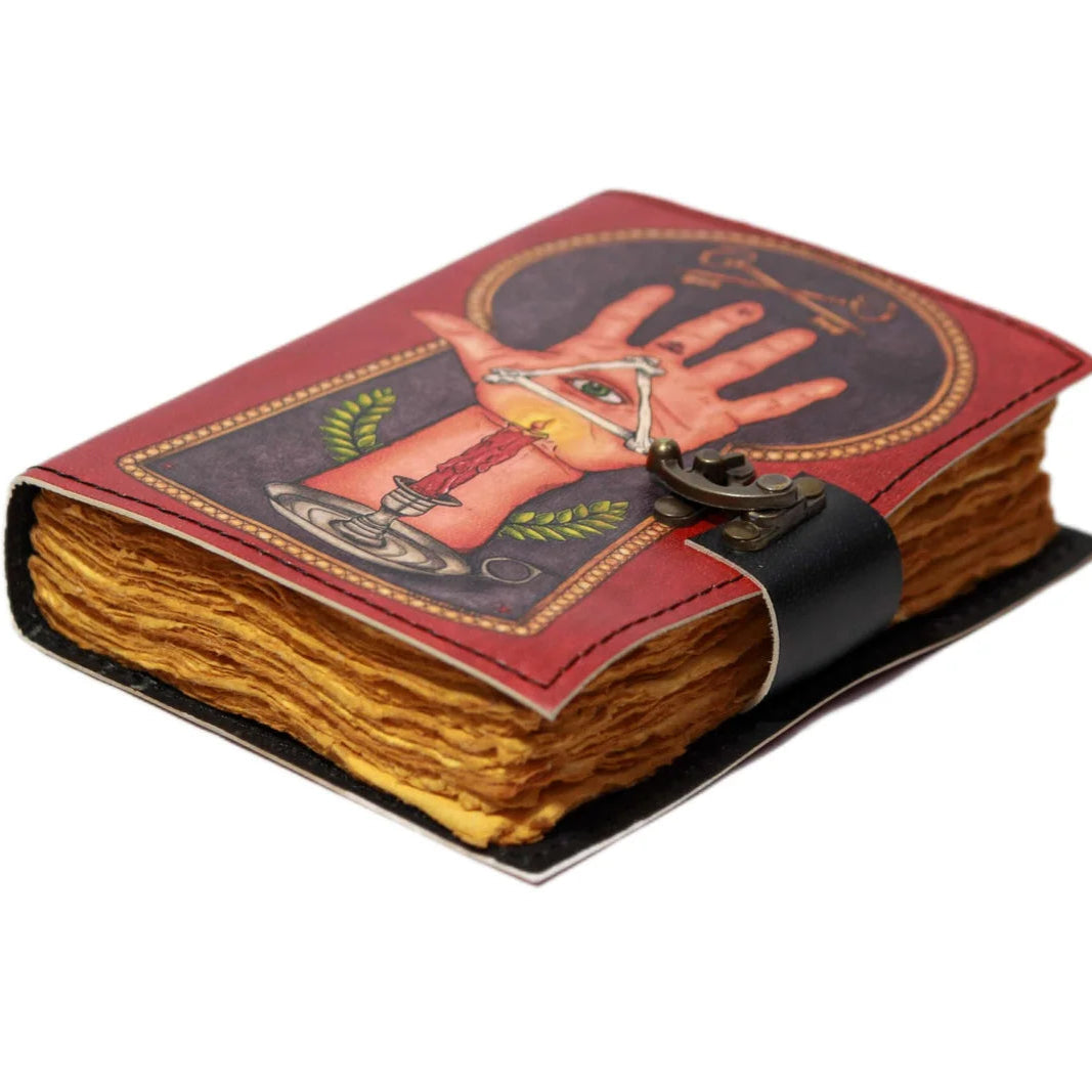 Decorative notebook with a hand design on the cover against a white background