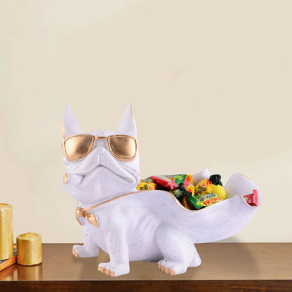 White dinosaur-shaped candy holder with gold sunglasses on a wooden surface.