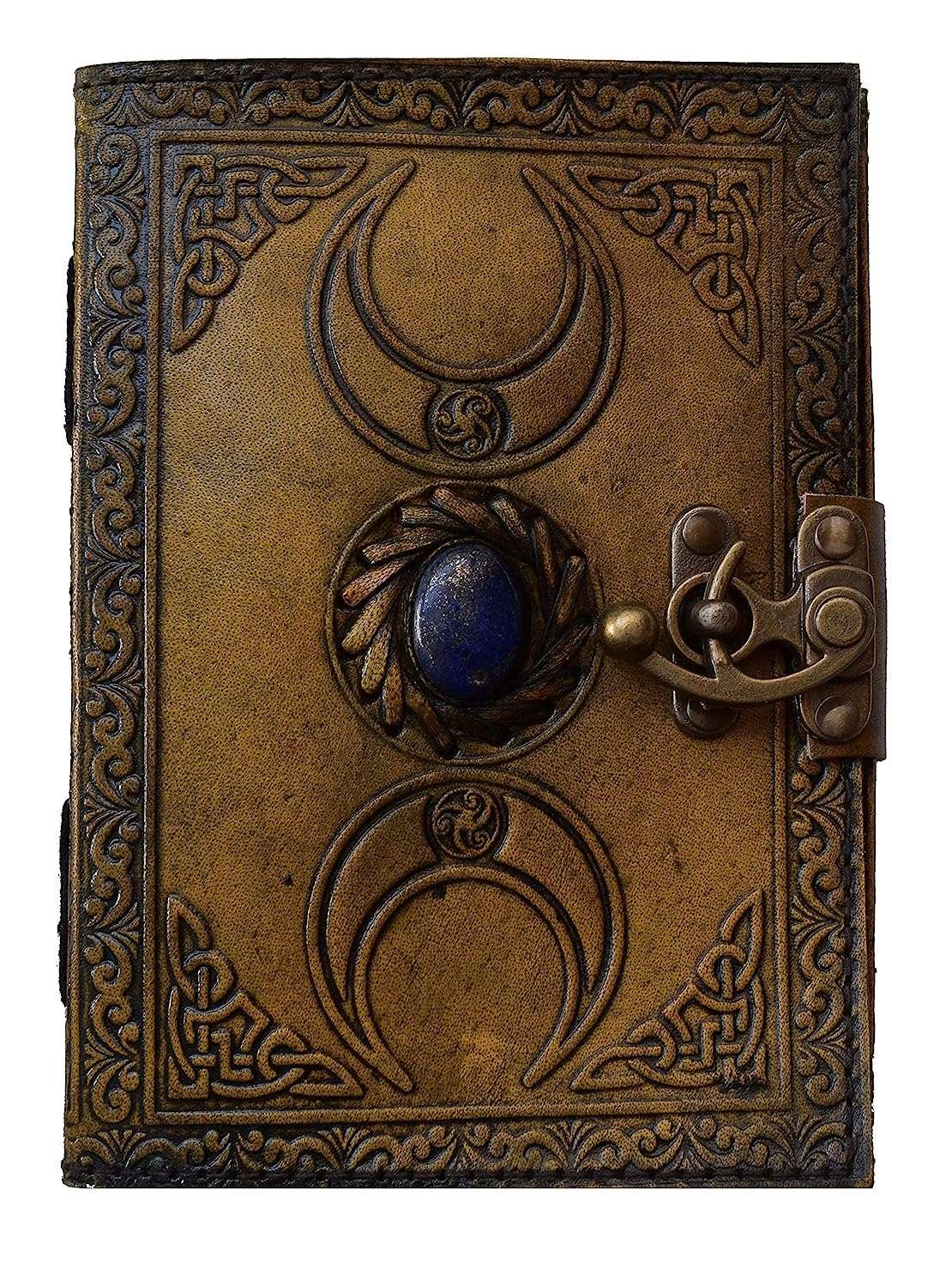 Decorative leather-bound book with Celtic knot patterns and a blue stone on a white background