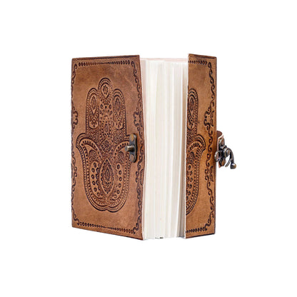 Brown leather journal with paisley patterns on a white background