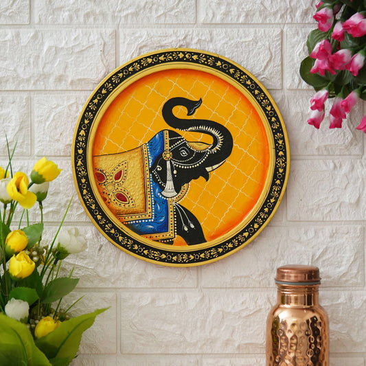 Colorful Pichwai elephant wall art featuring a decorative elephant on an orange background for home decor.