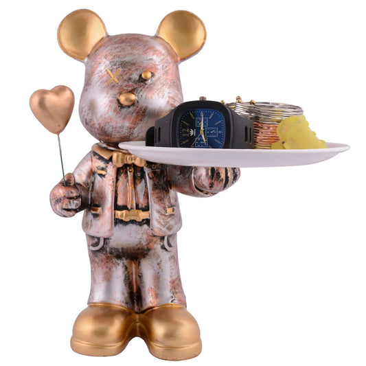 Decorative figurine of a mouse in a suit holding a tray with items on a white background